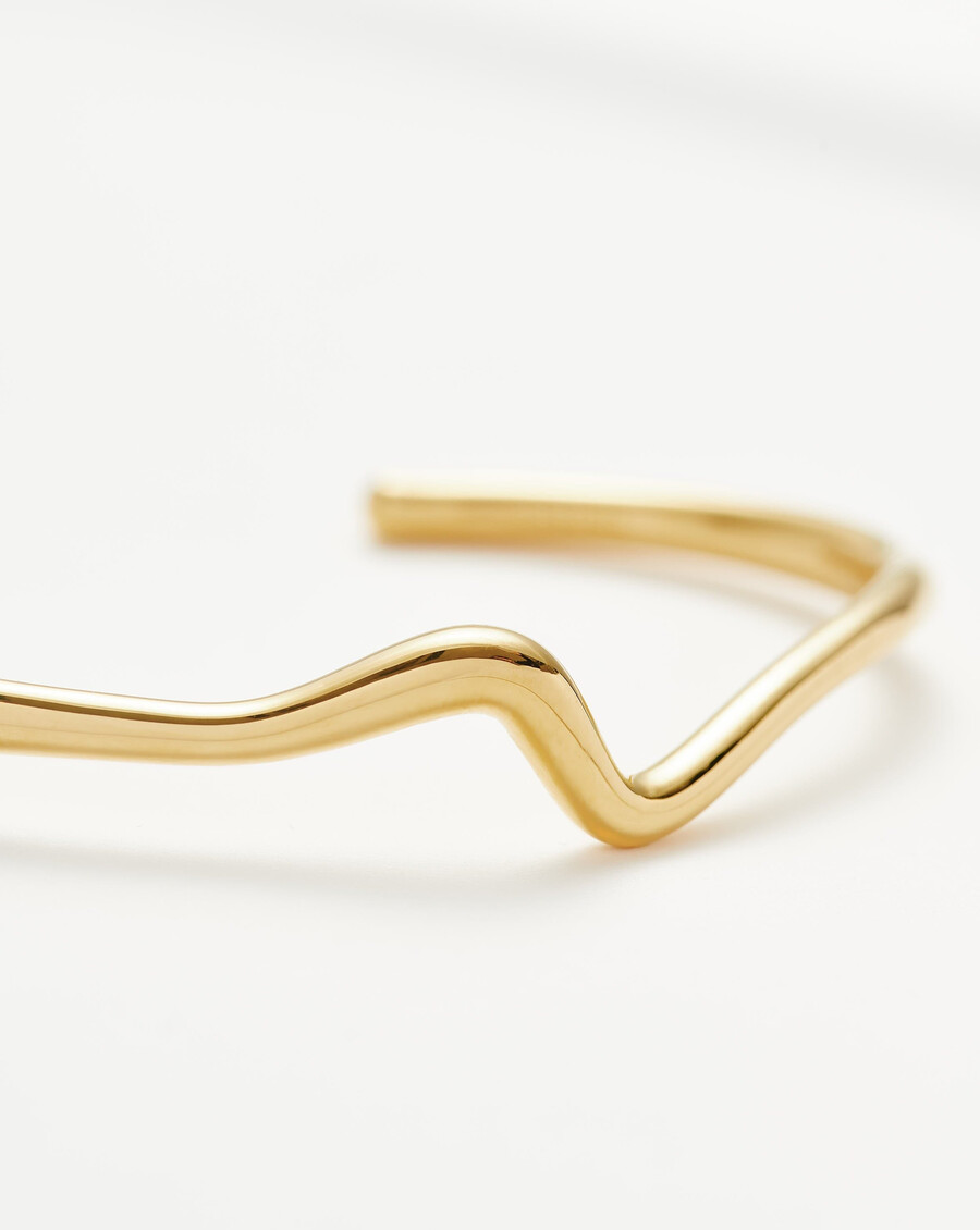 bracelet manchette en or à effet vague fondue