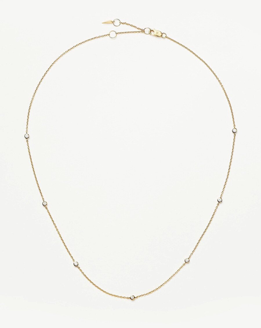 collier en or massif 14 carats avec diamants flottants.