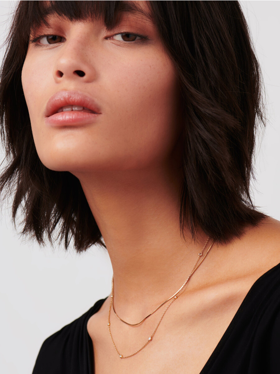 collier en or massif 14 carats avec diamants flottants.