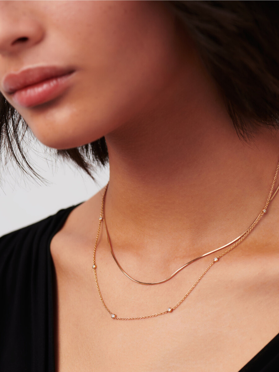 collier en or massif 14 carats avec diamants flottants.