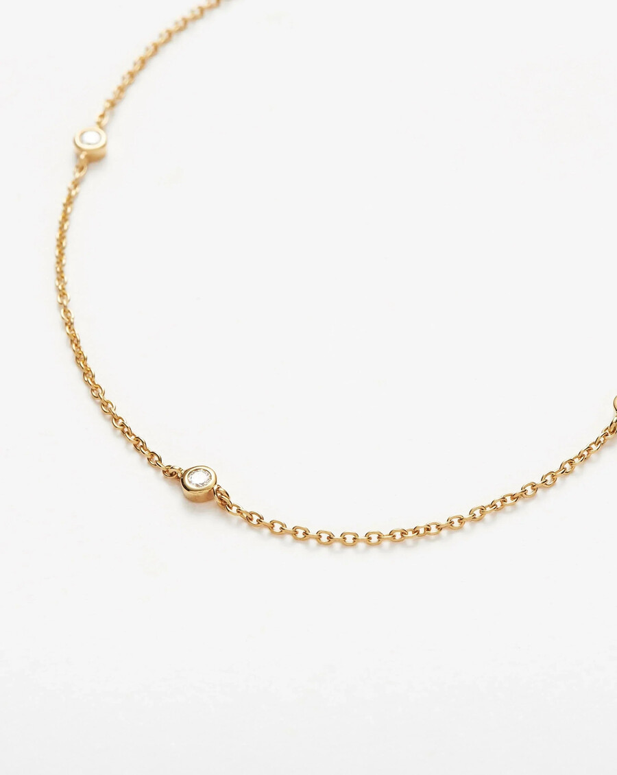 collier en or massif 14 carats avec diamants flottants.