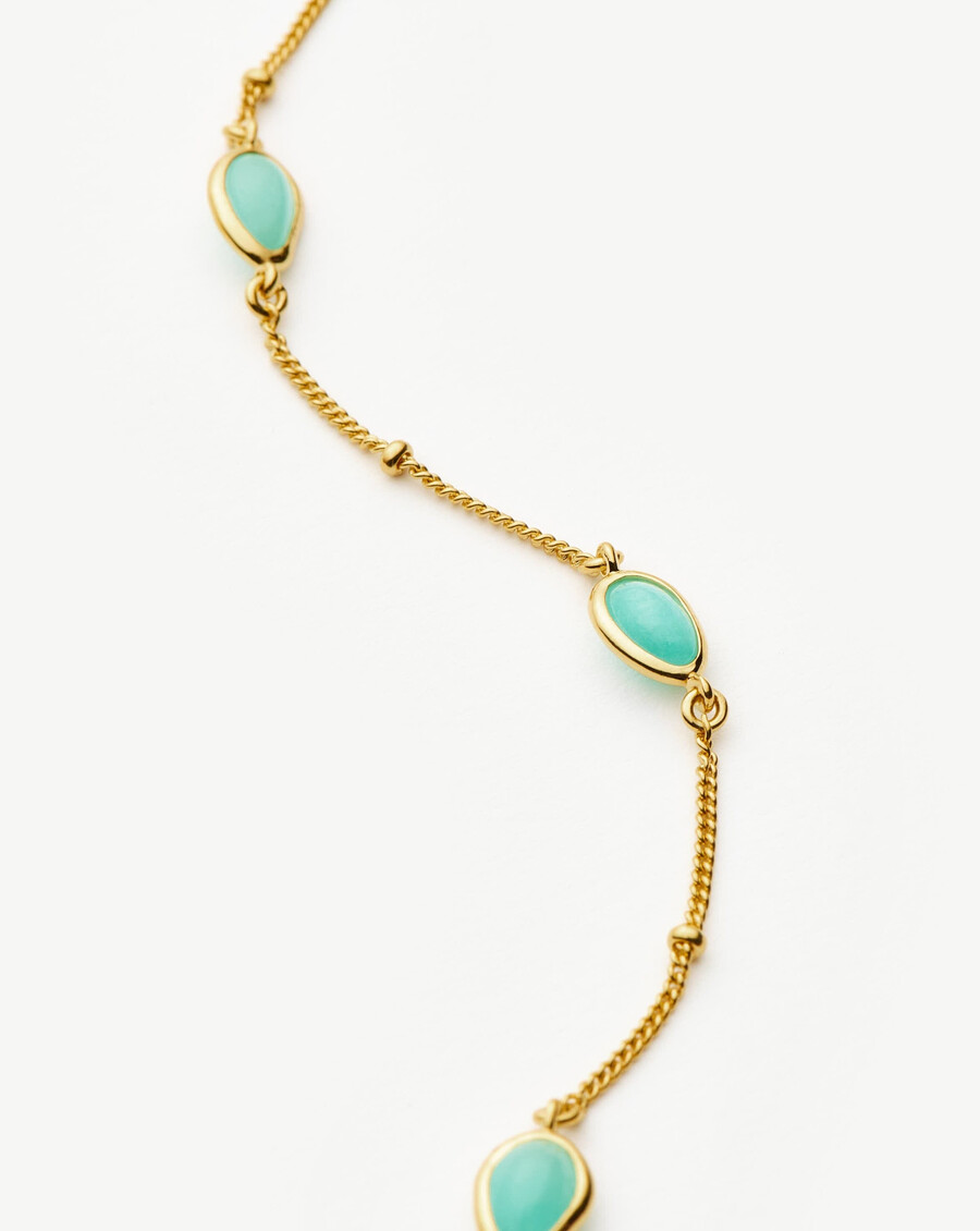 collier ras du cou doré avec pendentif en pierre précieuse magma
